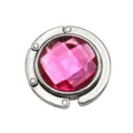 Close-up of portable folding metal bag hook with pink faceted crystal center - 4.50cm / Rose Red (Rhinestone Style)