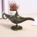 Close-up of an antique bronze Aladdin magic lamp with intricate floral engravings - Medium (12.5cm) / Antique Bronze