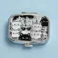 Detailed top-down view of a rectangular silver metal pill box featuring cute embossed cat patterns - Black & White Cats (Square Silver Frame)
