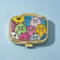 Compact square golden pill box featuring a colorful cartoon monster pattern lid - Square Cartoon Monster / 2 Compartments / Gold