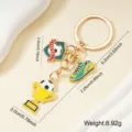 Premium metal football keychain featuring soccer shoe and trophy charm pendants. - Shield Shoe Style (003-C)