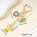 Gold-tone heart clip soccer keychain with trophy, shoe and ball charms, 13.1g weight. - Heart Shield Style (003-D)