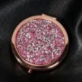 Close-up of a rose gold folding compact mirror with pink glitter and silver studs. - 70mm / Purple starry sky (rose gold)