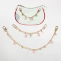 Elegante gouden metalen tassenketting met roze emaille bloemen en witte parelhangers - 20cm / Roze Madeliefje