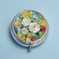 Exquisite round silver metallic pill box featuring a vibrant white rose floral art lid - Clear Blue & White Camellia (Round Silver Frame)