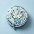 Round metal pill box with white rose and blue floral pattern on light blue background - Oil Painting White Peony (Round Silver Frame)