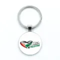 Close-up of circular Palestine flag keychain featuring a heart-shaped anti-war design. - Love Palestine Style (9-玻璃款) / Glass Style