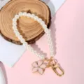 Elegant white pearl bead keychain with pink flower pendant and gold hardware. - Pink Gold-Trim Flower Style (Style 16)