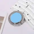 Close-up detail of a portable folding desk bag hook in silver metal with a light blue inlay - Single Hook Folding Style / Blue