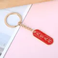 Red enamel lucky keychain with Good Fortune and Great Profit text for student gift - Oval Good Fortune