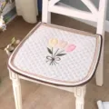 Detail view of the quilted chair cushion featuring a cute tulip embroidery design for home dining. - Tulip Embroidery / 44x45cm / Beige