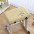 Close-up detail of thickened student chair cushion with cute mushroom embroidery. - Mushroom House - Gold