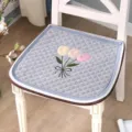 Detail shot of a thick quilted chair cushion featuring elegant tulip embroidery and clean edge binding. - Tulip Embroidery / 44x45cm / Gray