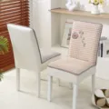 Detailed view of the quilted dining chair cover showcasing soft texture and neat stitching. - Orange