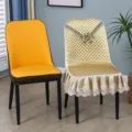 Detail view of luxury quilted dining chair cover with delicate lace and embroidery for home use. - Curved Chair Cover / Single Piece / Yellow