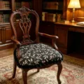 Detailed view of vintage wooden armchair with floral pattern cushion in study room. - 40*43 cm / Overlapping Shadows Black Seat Cushion