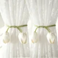 Close-up detail of cream style white lace curtains with elegant green tulip flower tiebacks. - Tulip Beige Straps