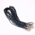 Close-up of black braided necklace cords with silver-plated lobster clasps and chains. - Single Piece / Black
