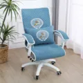 Close-up detail of quilted blue office chair cushion cover set with delicate deer embroidery. - Together Blue