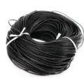 Close-up macro view of coiled black genuine leather cord for DIY jewelry making - 1.5mm / Black
