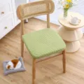 Detailed view of the thickened green embossed knit chair cushion placed on a wooden chair. - Diamond Plaid Green Cushion with Core