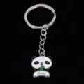 Macro view of a cute enamel panda keychain pendant with green leaf and lovely text - 熊猫11款式