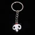 Close-up detail of a cute cartoon panda keychain with red crown and metal ring - 熊猫06款式