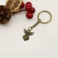 Elegante llavero vintage con alas de ángel de bronce y decoración rústica de invierno - Bronce Antiguo