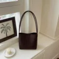 Elegant dark brown hand-woven shoulder bag with minimalist French design for women - Coffee Bag Only