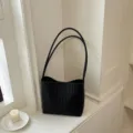 Minimalist black woven shoulder bag with dual straps for commuting. - Black - Single Bag