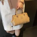 Elegant beige woven texture small tote bag with metal lettering for women's daily commute - Khaki