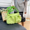 Trendy lime green drawstring shoulder tote bag in utility canvas style for summer - Green