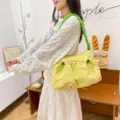 Yellow workwear style canvas tote bag with green ruched shoulder strap - Yellow