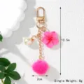 Detailed size view of pink flower pom-pom keychain with dimensions 10.5cm and 8g weight - Rose Red