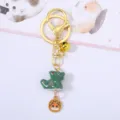 Detail of Chinese zodiac dragon ceramic keychain with gold bell and charm - Dragon