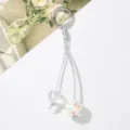 Close-up of cute star and clear bead keychain charm with colorful flower patterns - Pentagram Pearl