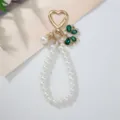 Elegant faux pearl loop keychain featuring a green rhinestone bow and heart-shaped clasp. - Dark Green