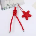 Handmade red PU leather knotted keychain featuring padded star charm and heart carabiner - Red