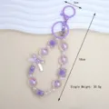 Detailed view of purple bow beaded keychain with dimensions 18cm and weight 30.5g - Purple
