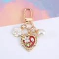 Vintage gold heart keychain with white flower and pearl charms for bag - Burgundy