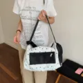 Large white canvas travel bag featuring black star prints for sports and gym use - Black