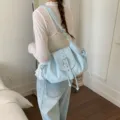 Stylish light blue nylon shoulder bag with buckle flap for casual daily wear. - Blue