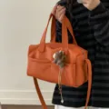 Large orange litchi grain tote bag made of soft leather with a detachable strap - With Horse Charm / Orange