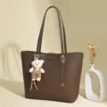 Elegant dark brown faux leather tote bag with a cute bear charm, perfect for daily commute - Light Coffee
