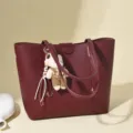 Stylish burgundy large capacity leather tote bag with a cute bear charm for daily commuting - Burgundy