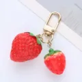 Cute strawberry keychain with two realistic fruit charms and golden clasp for bags. - Large & Small Strawberries / Single OPP Bag Packaging