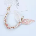 Close-up of elegant silk scarf phone chain with gold lobster clasps and floral pattern - Style L