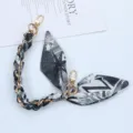 Short phone lanyard with black and white letter print silk scarf and gold chain detail - Style Z