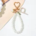 Close-up of pearl alphabet keychain with gold heart clasp and pearl letter P detail - Letter P Style / Pearl White