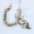 Close-up of golden metal phone chain strap with printed silk scarf and double swivel clips - Style M